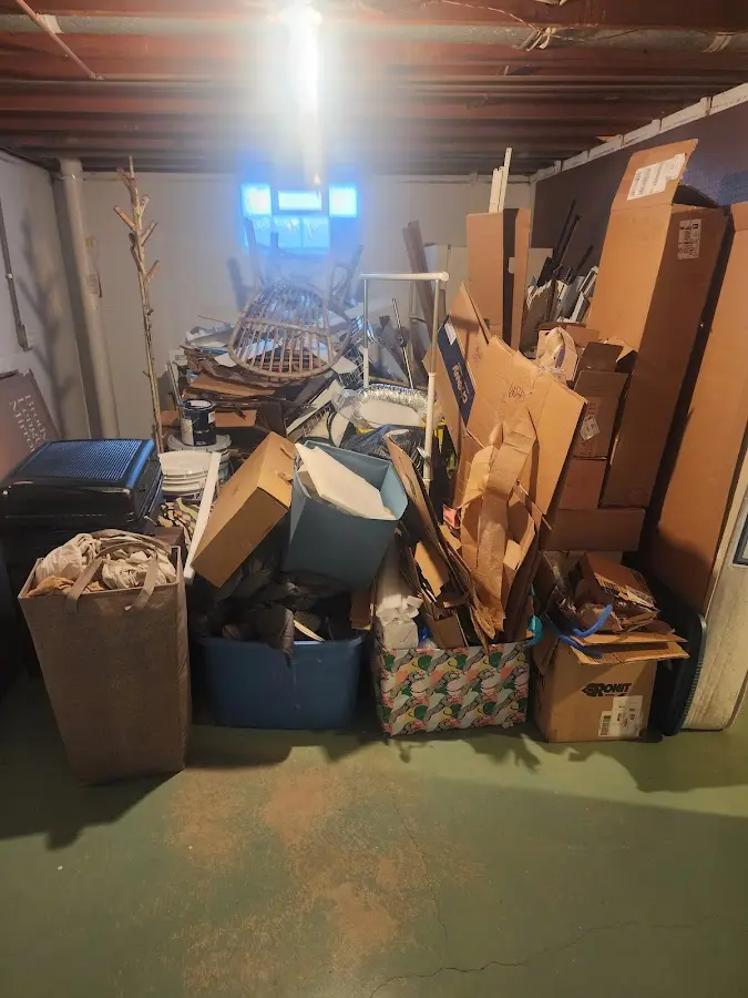 Roll-off dumpster container at job site for 2 Yard Dumpster Rental in North Fond du Lac